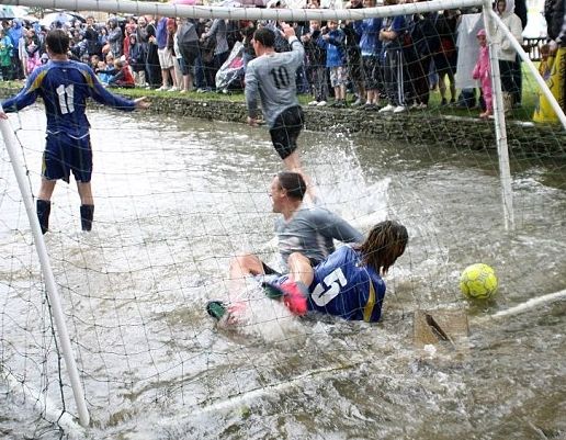 Everyone has a splashing time at the annual football in the river match at Bourton-on-the-Water.  